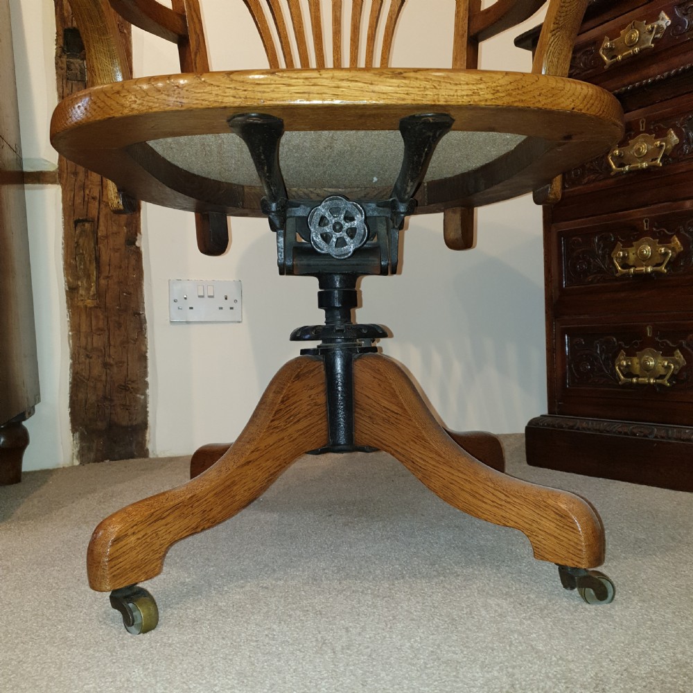 Light oak & leather seated revolving desk chair - presented to W Deedes by the past & present boys in 1912 View V