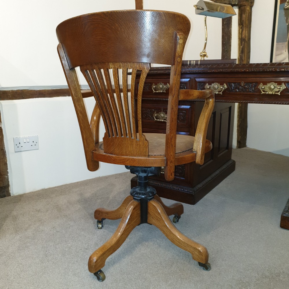 Light oak & leather seated revolving desk chair - presented to W Deedes by the past & present boys in 1912 View VI