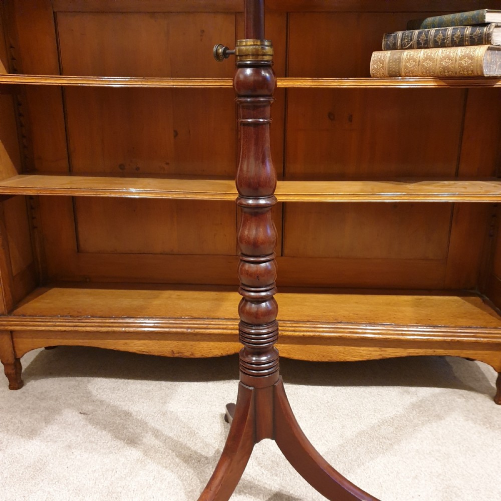 An adjustable mahogany occassional or reading table View IV