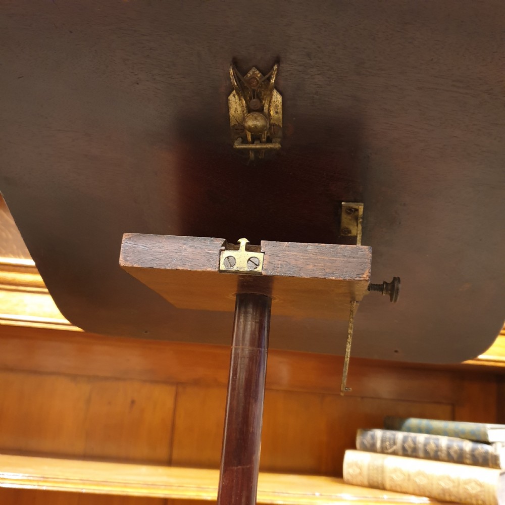An adjustable mahogany occassional or reading table View VI