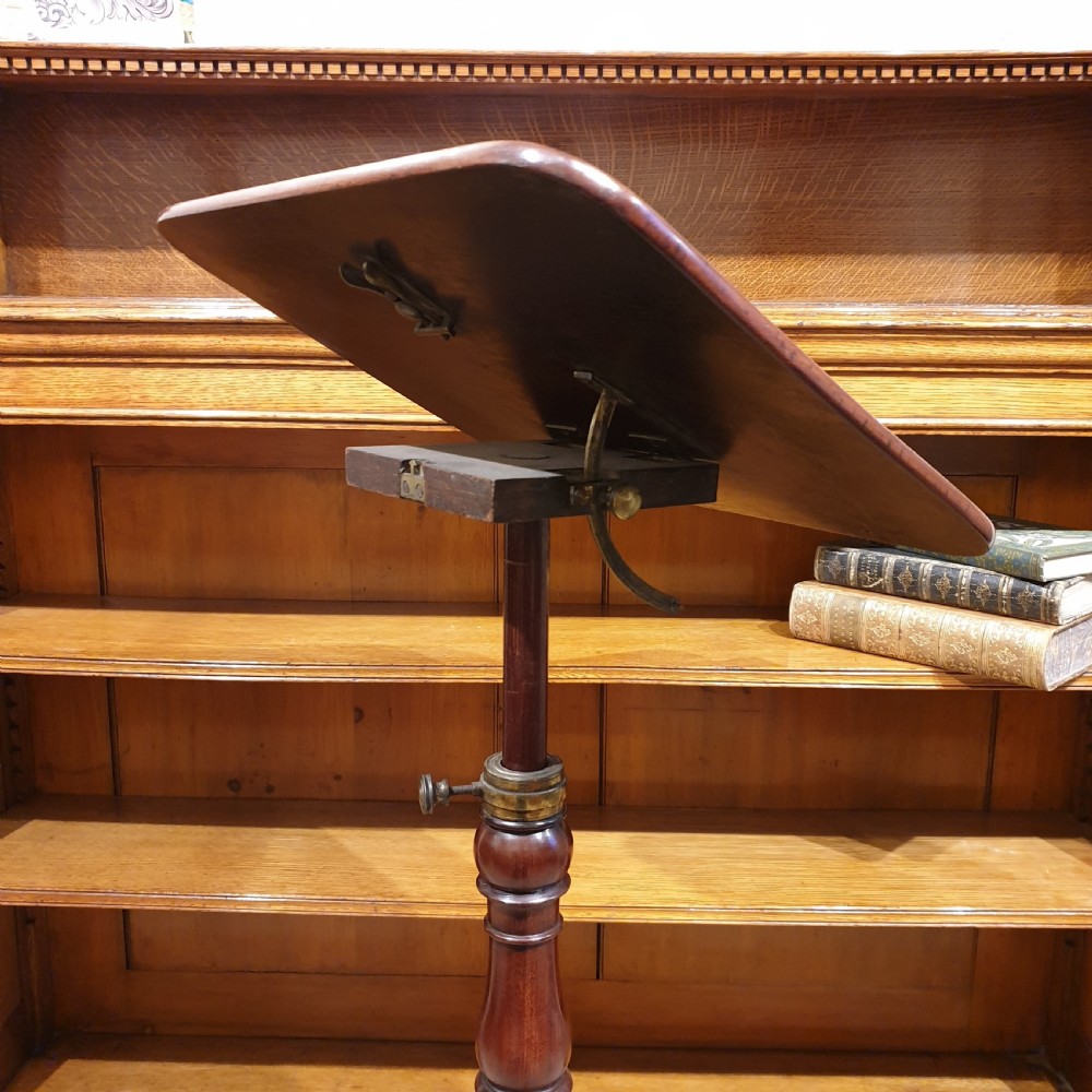 An adjustable mahogany occassional or reading table View VII