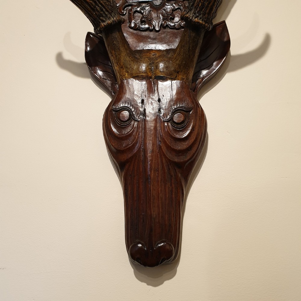 A 19th Century carved & decorated wooden stag's head  View V