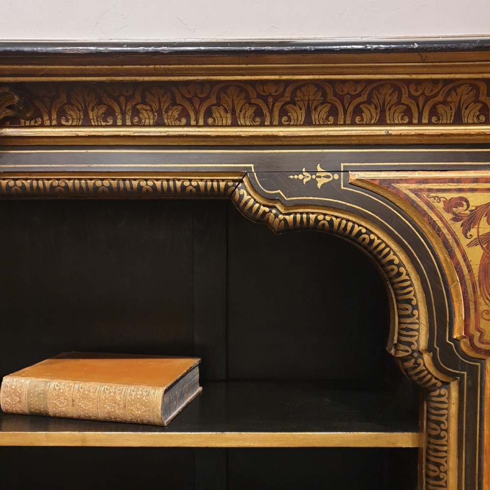 An ebonised open bookcase with gilded & faux boulle decoration View III