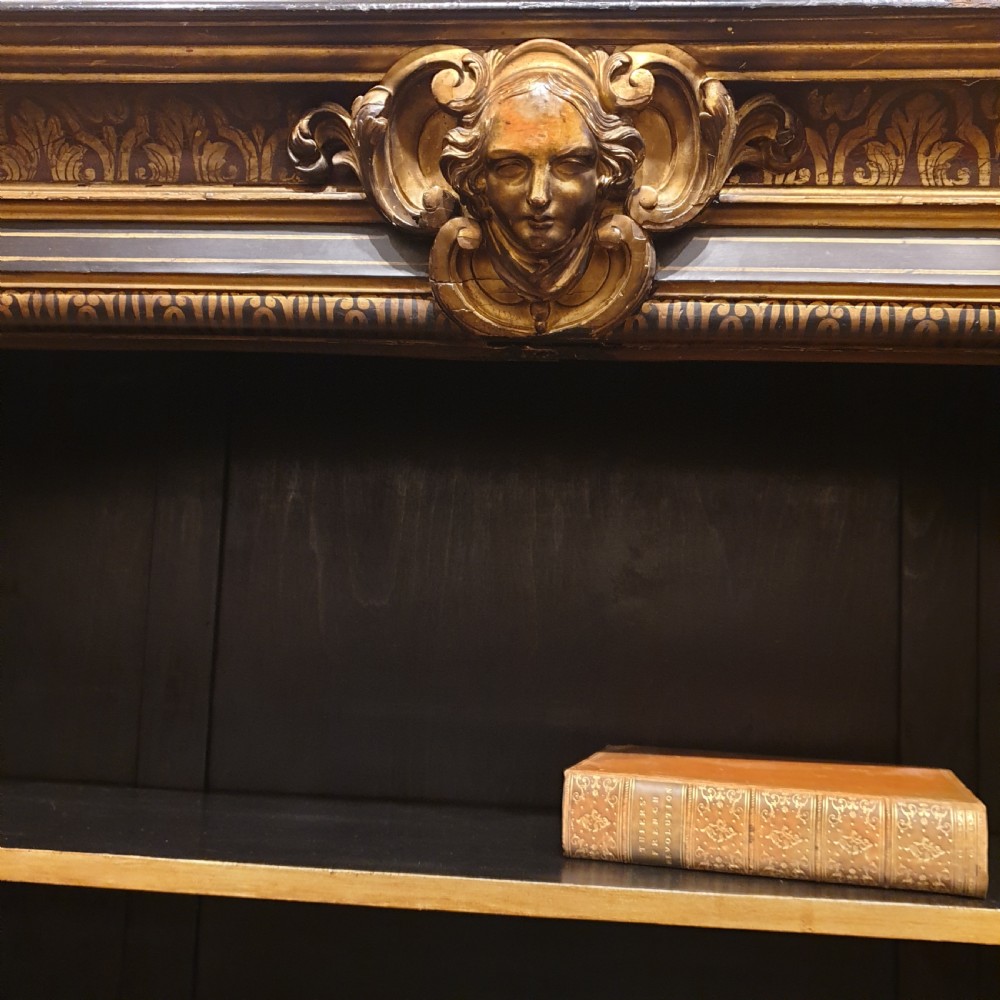 An ebonised open bookcase with gilded & faux boulle decoration View V