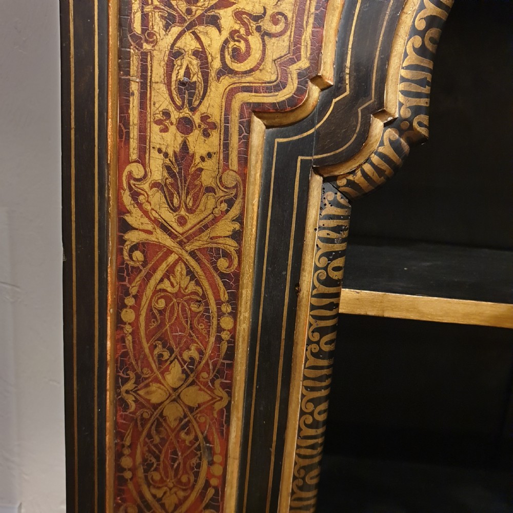 An ebonised open bookcase with gilded & faux boulle decoration View VII