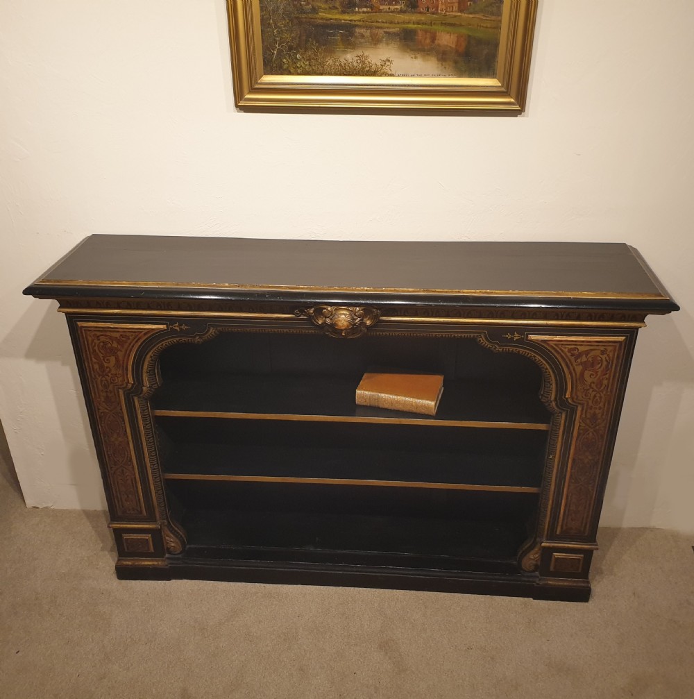 An ebonised open bookcase with gilded & faux boulle decoration View IX