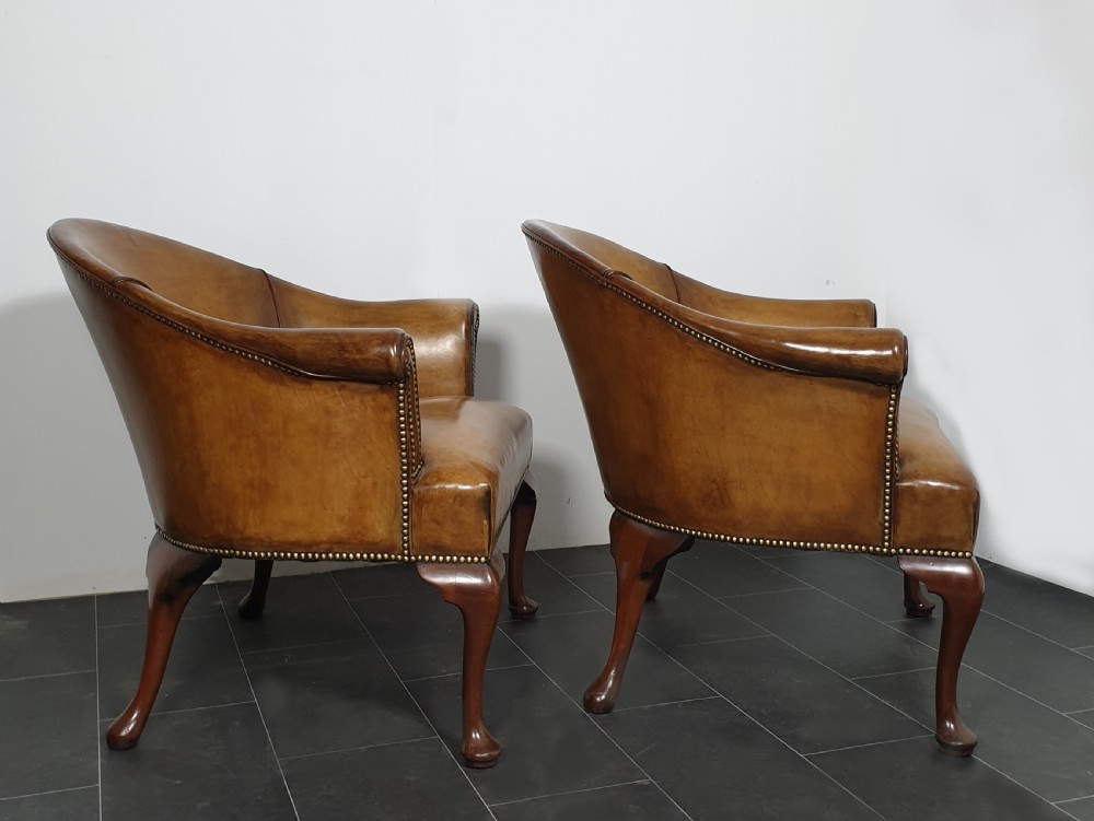 Pair of leather tub chairs View V