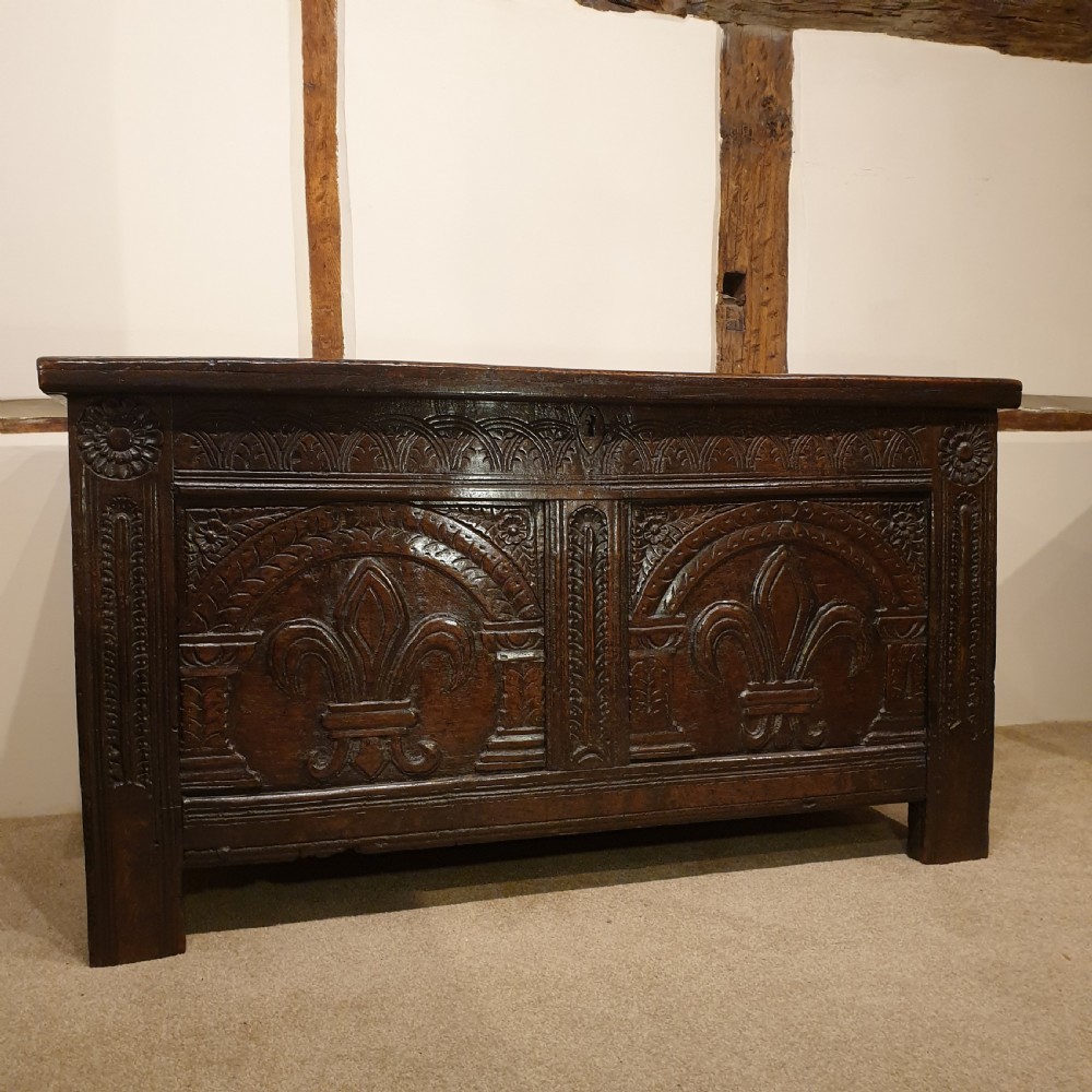 Mid 17th Century oak coffer with original feur de lis carved decoration 
