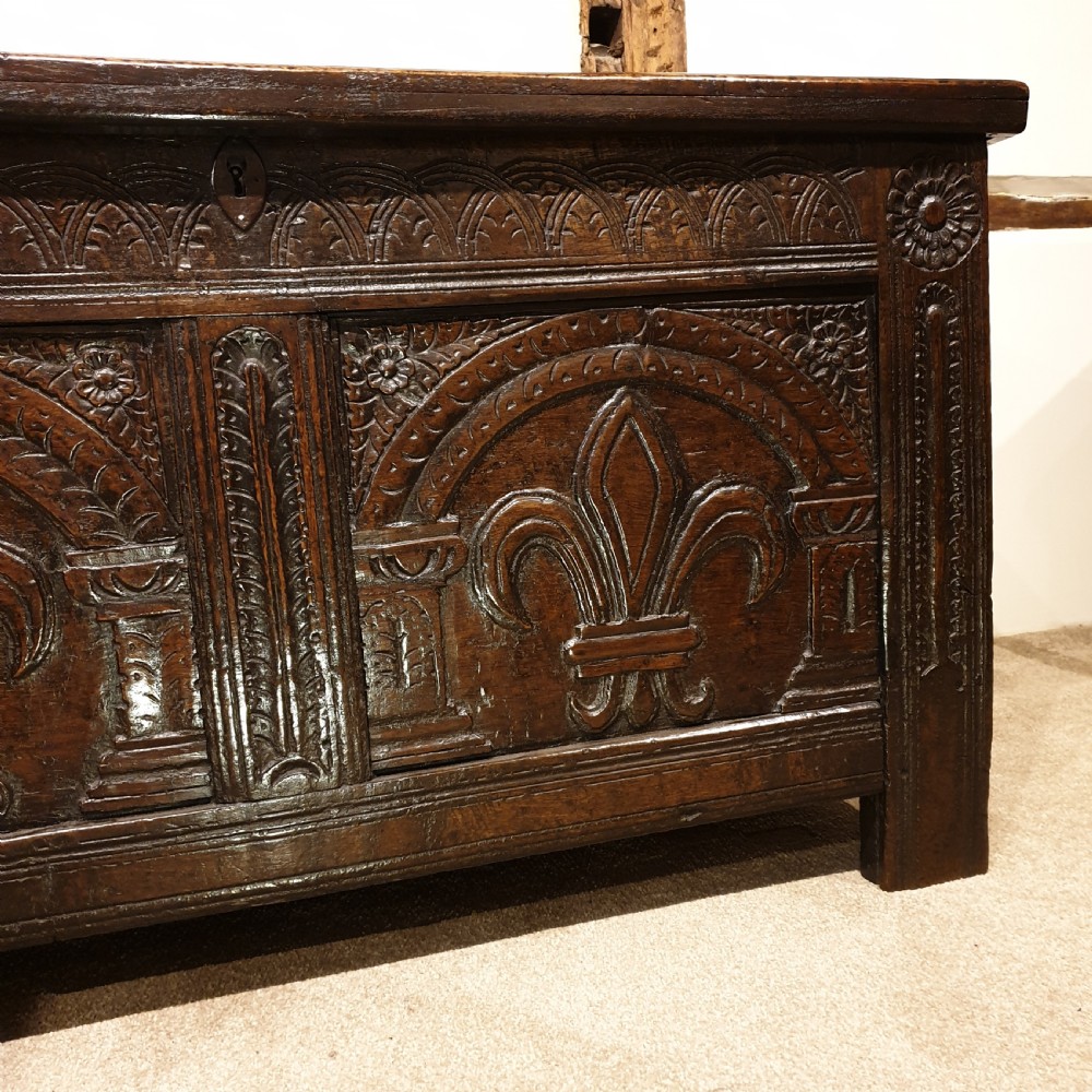 Mid 17th Century oak coffer with original feur de lis carved decoration  View III