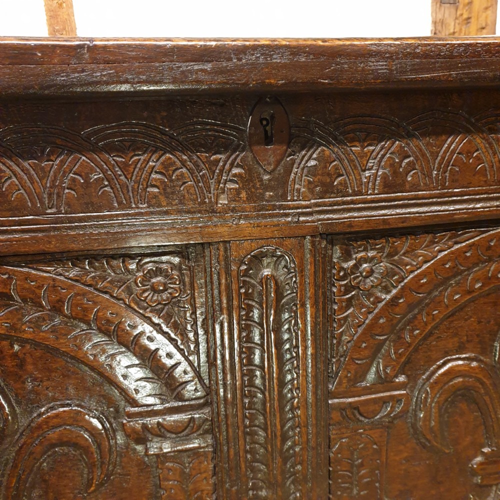 Mid 17th Century oak coffer with original feur de lis carved decoration  View IV
