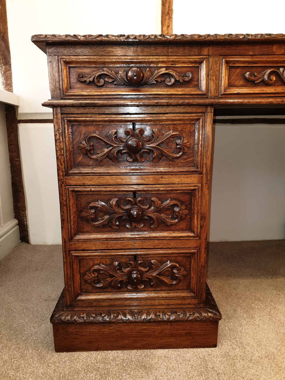 A fine panelled oak pedestal desk by Wetson & Thexton of Tottenham Court Road, London.  View III