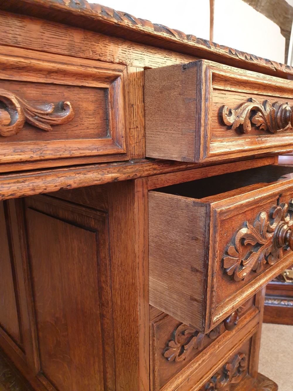 A fine panelled oak pedestal desk by Wetson & Thexton of Tottenham Court Road, London.  View IV
