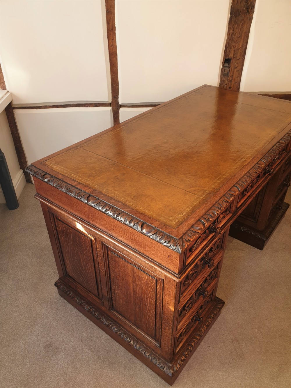 A fine panelled oak pedestal desk by Wetson & Thexton of Tottenham Court Road, London.  View V