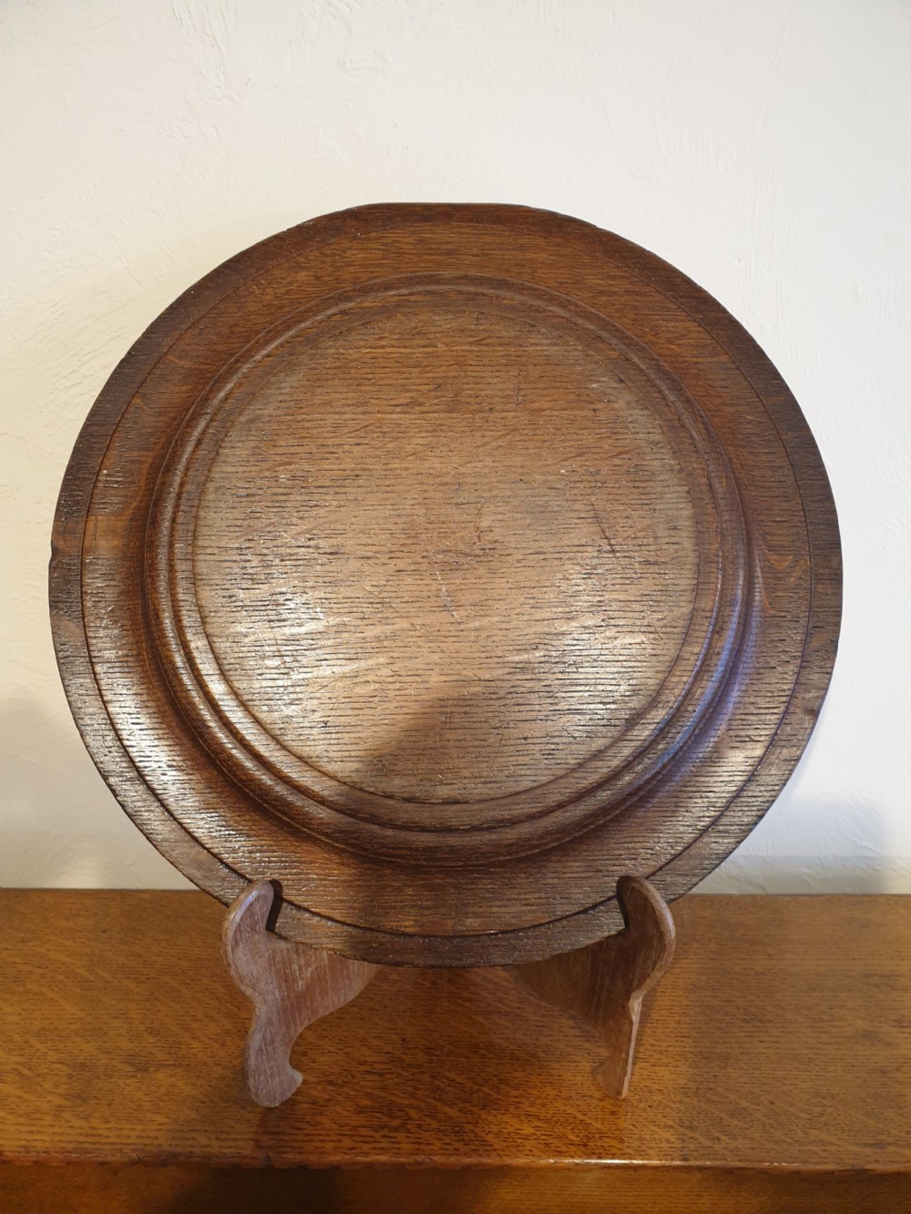 An finely carved and decorated oak alms dish  View II