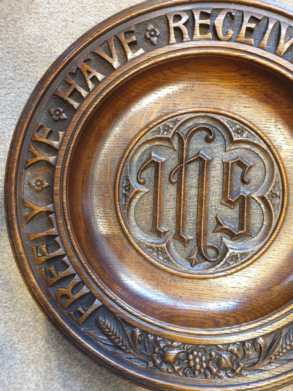 An finely carved and decorated oak alms dish  View IV