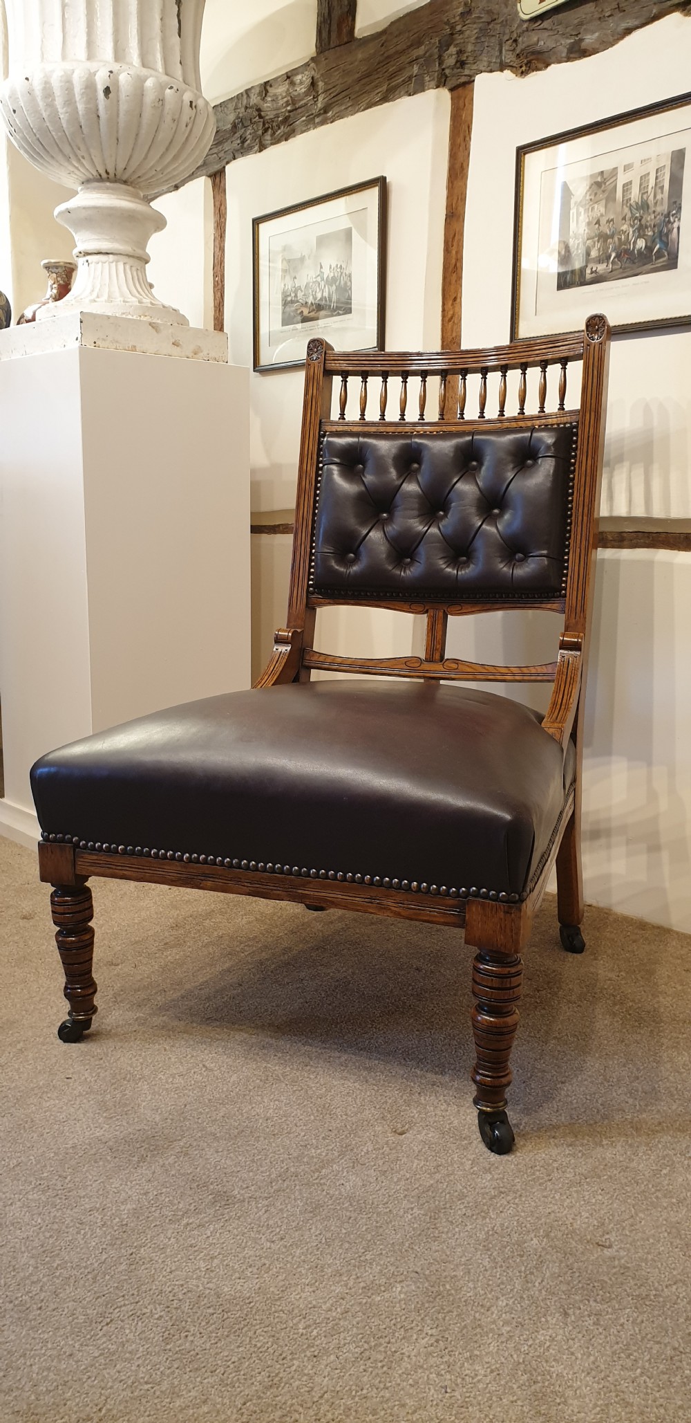 A button backed leather upholstered oak aesthetic movement armchair with a matching slipper chair  View IV