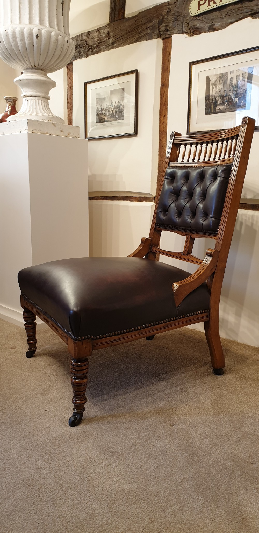 A button backed leather upholstered oak aesthetic movement armchair with a matching slipper chair  View V
