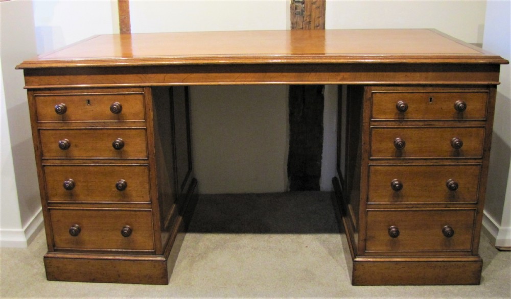 A fine 19th Century Oak Pedestal desk with paneled sides 