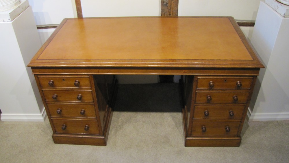A fine 19th Century Oak Pedestal desk with paneled sides  View II