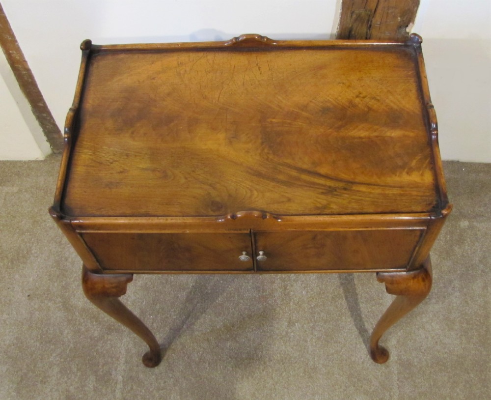 An elegant walnut occasional table  View IV