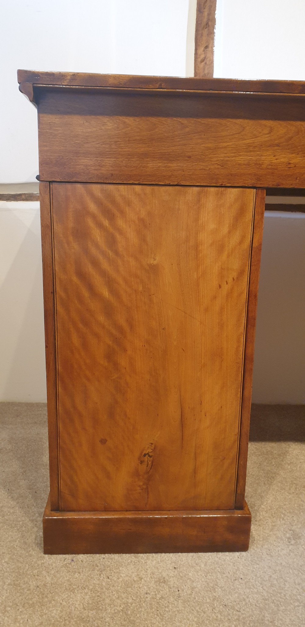 A 19th-century satin birch pedestal desk featuring nine drawers with turned wooden handles and a green leather inset writing surface. View VIII
