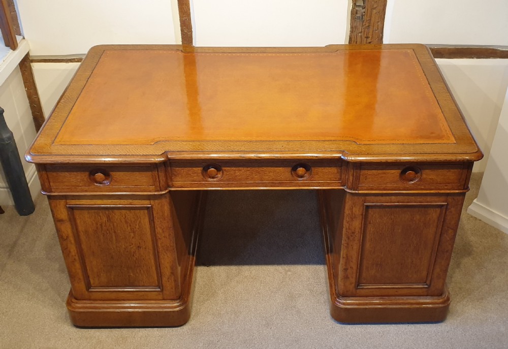 Late 19th Century oak pedestal desk with turned inset handles  View II
