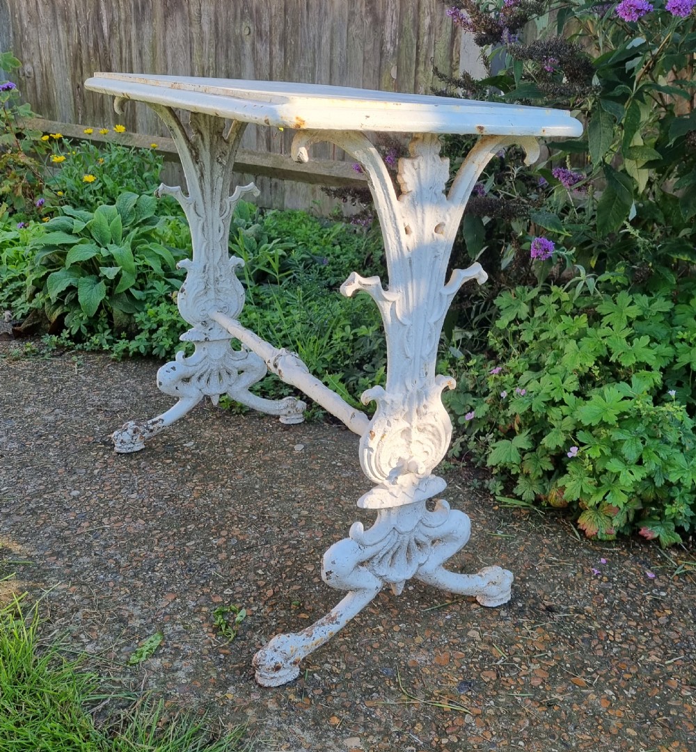 A Victorian cast iron conservatory stretcher table attributed to Coalbrookdale (Circa 1850)
