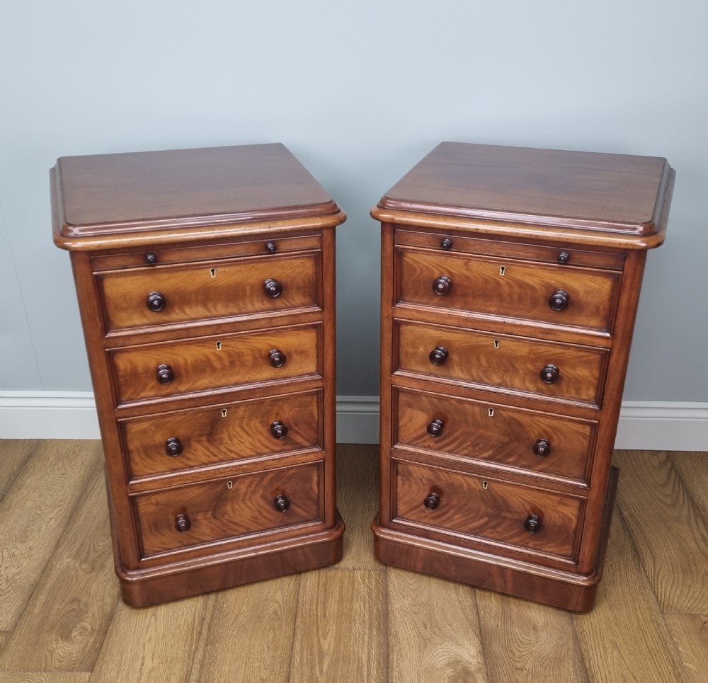 A fine pair of mahogany pedestal bedside chests with brushing slides View II