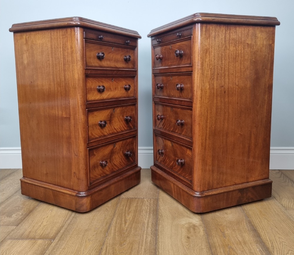 A fine pair of mahogany pedestal bedside chests with brushing slides View IX