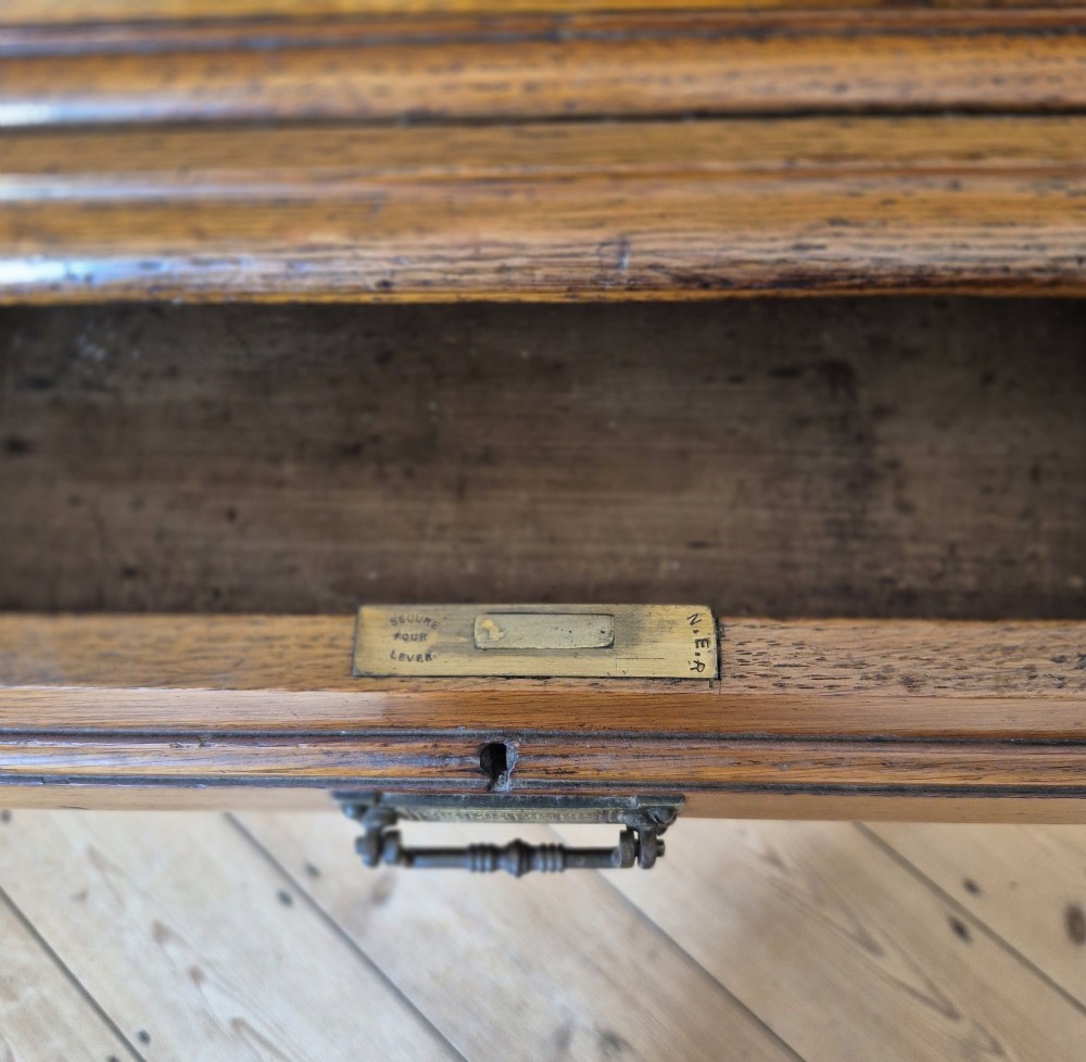 A late 19th-century golden oak ticket collecting box with internal compartments set atop a matching turned-leg stand. View VII