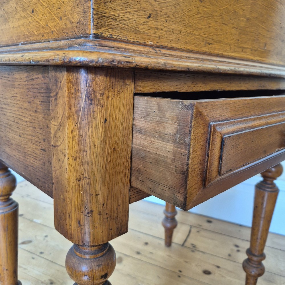 A late 19th-century golden oak ticket collecting box with internal compartments set atop a matching turned-leg stand. View IX