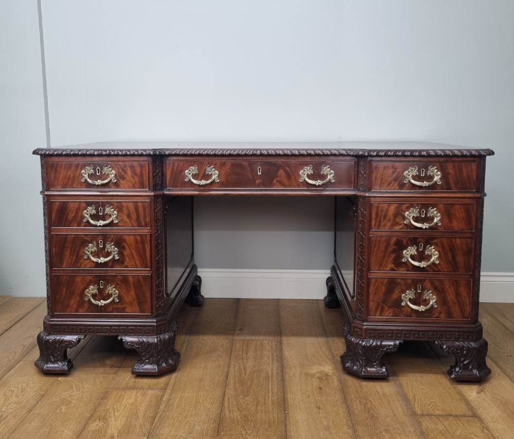 A fine antique mahogany pedestal desk in the manner of Thomas Chippendale