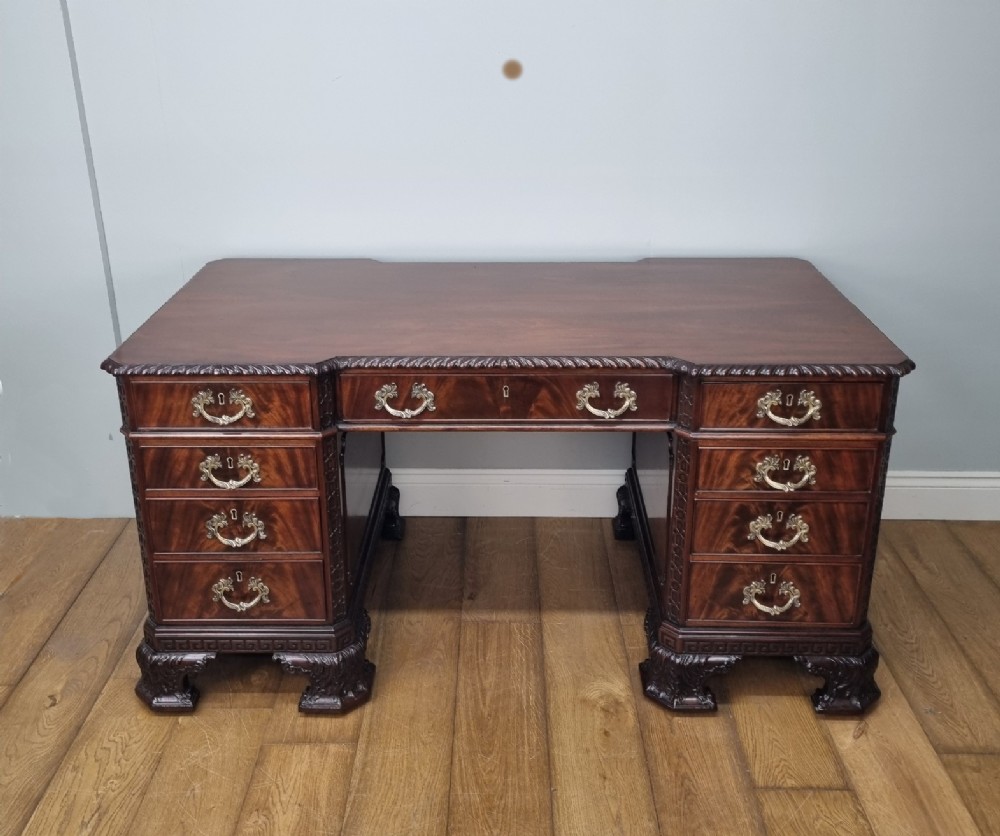 A fine antique mahogany pedestal desk in the manner of Thomas Chippendale View II