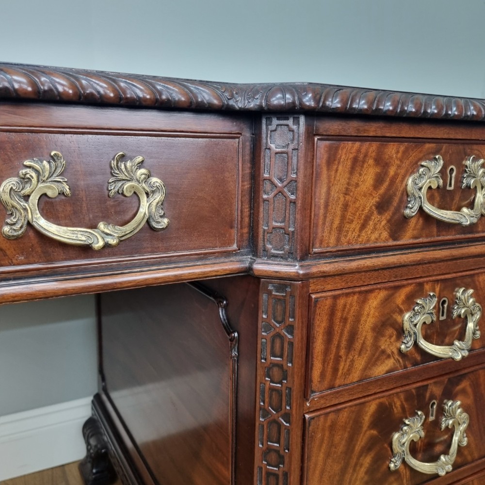 A fine antique mahogany pedestal desk in the manner of Thomas Chippendale View VI