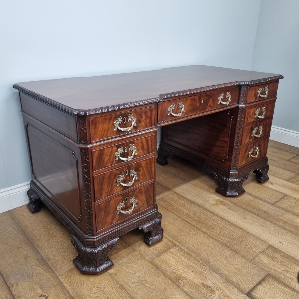 A fine antique mahogany pedestal desk in the manner of Thomas Chippendale View VII