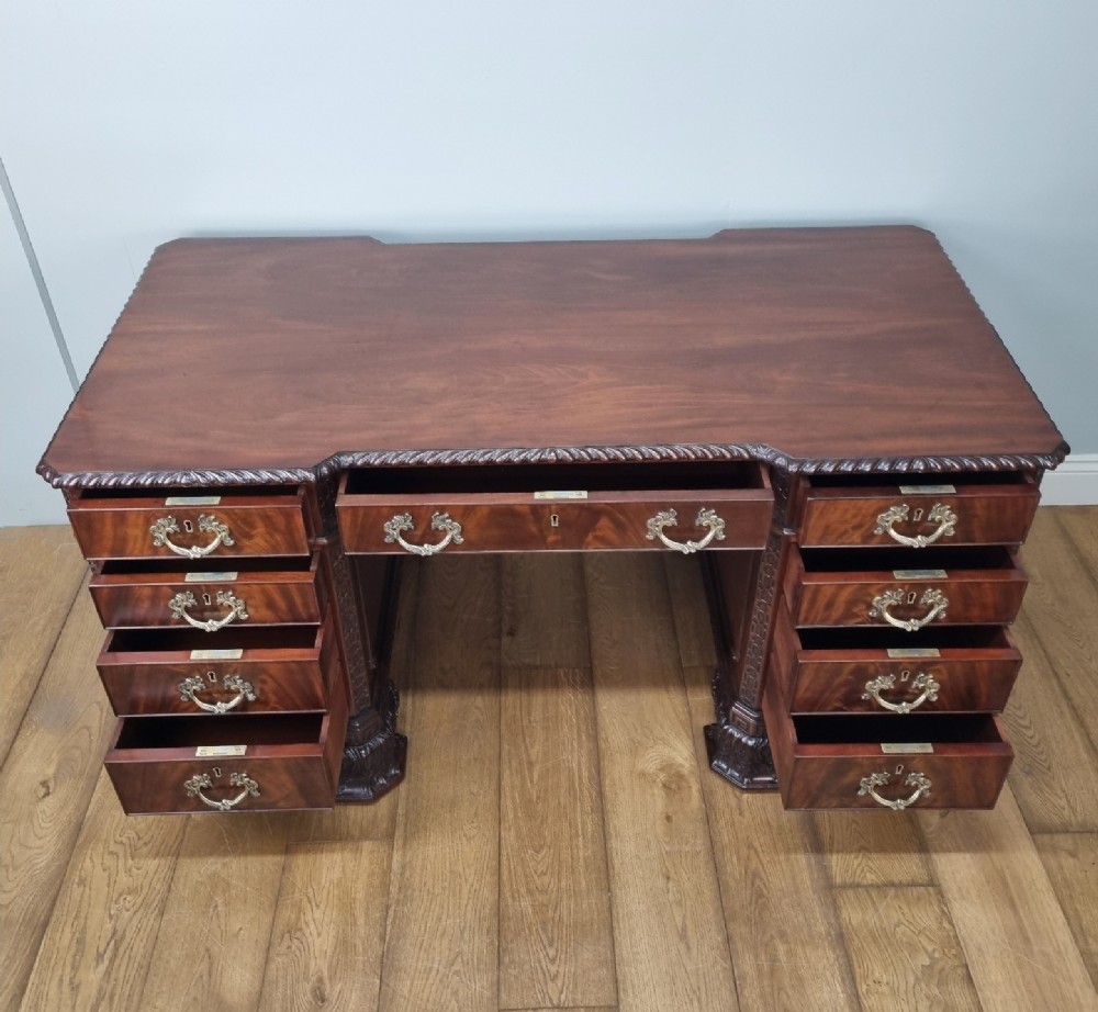 A fine antique mahogany pedestal desk in the manner of Thomas Chippendale View IX