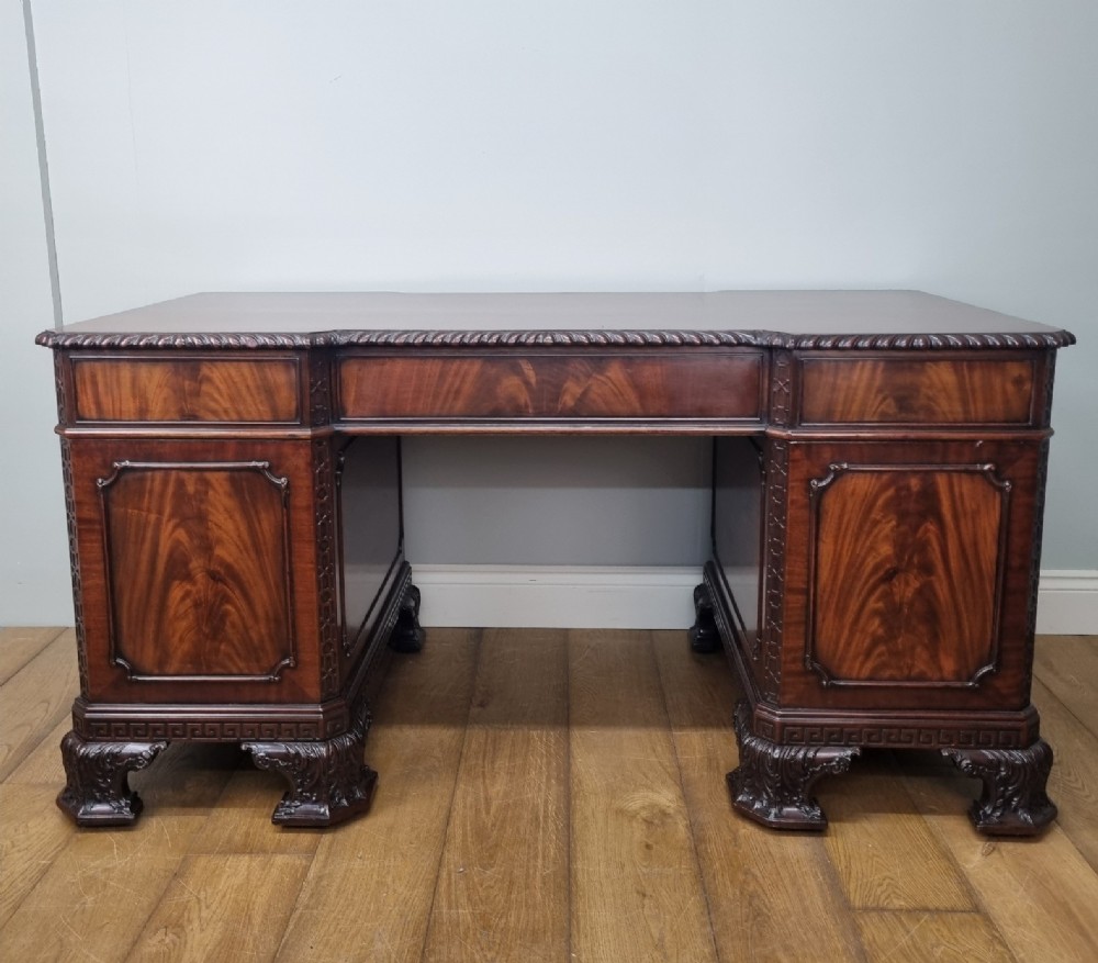 A fine antique mahogany pedestal desk in the manner of Thomas Chippendale View X