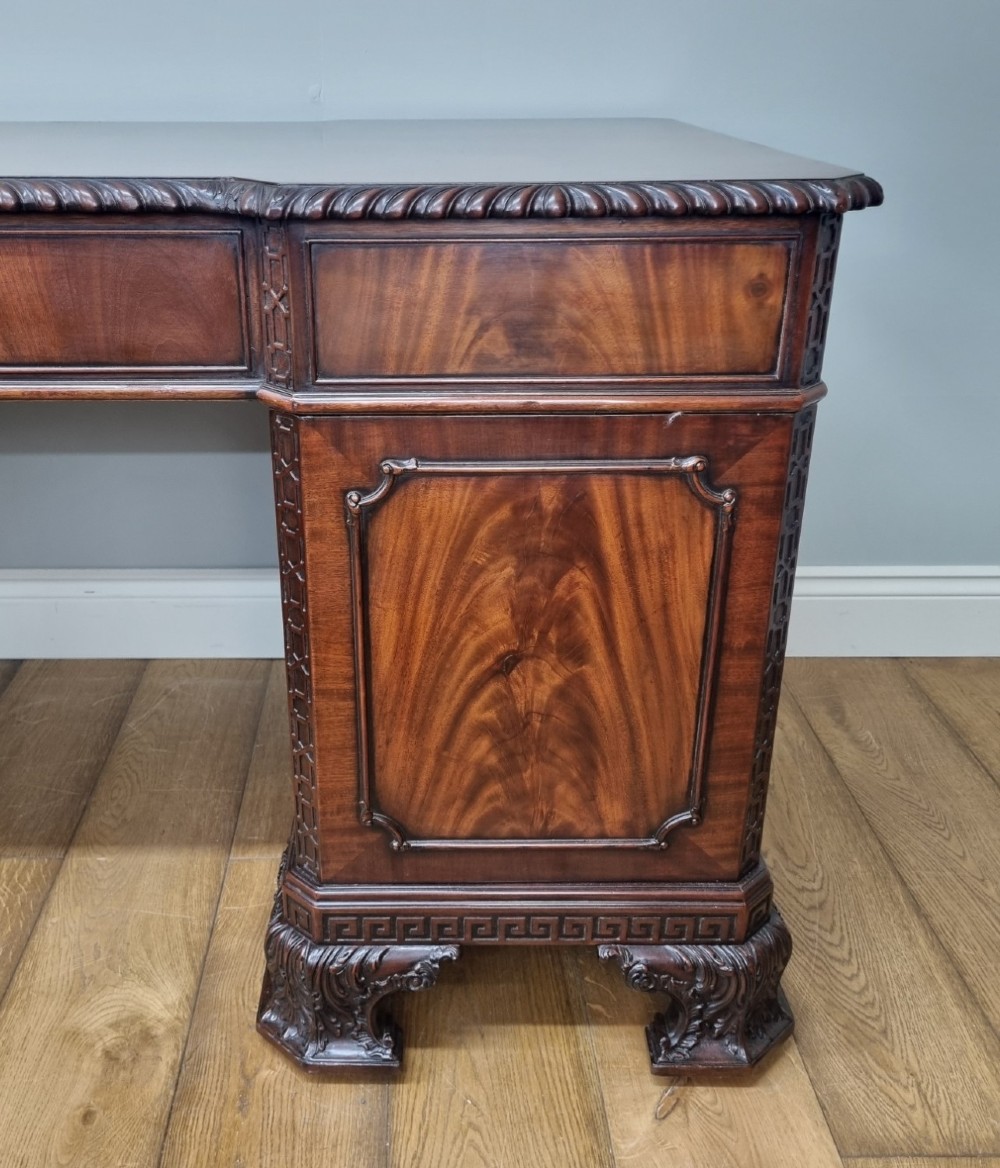 A fine antique mahogany pedestal desk in the manner of Thomas Chippendale View XI