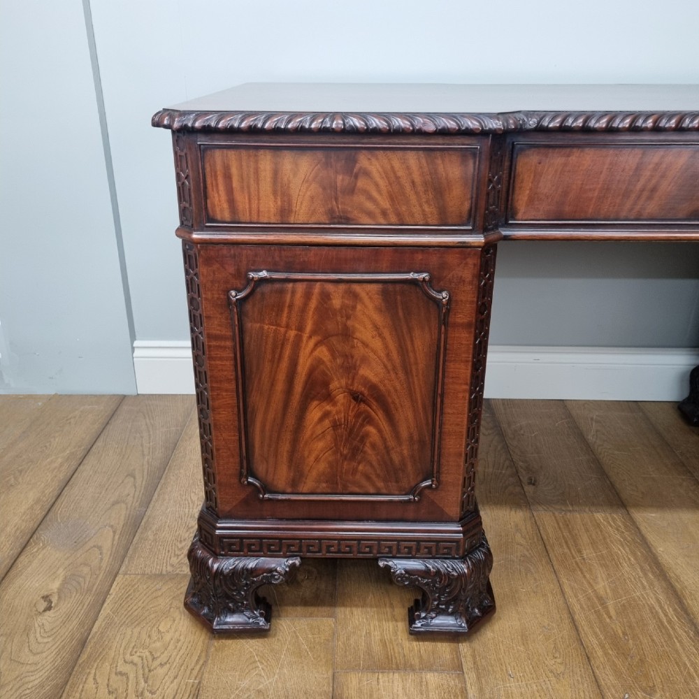 A fine antique mahogany pedestal desk in the manner of Thomas Chippendale View XII