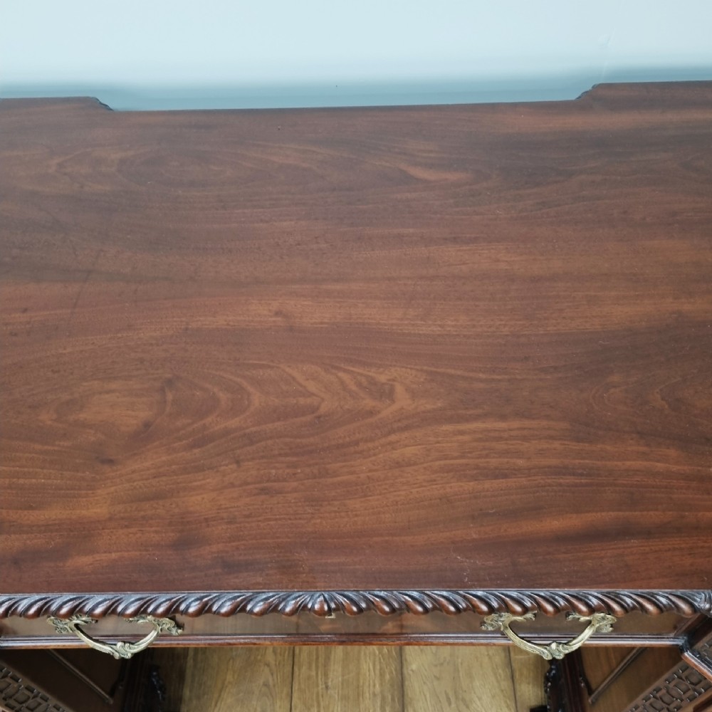A fine antique mahogany pedestal desk in the manner of Thomas Chippendale View XIII