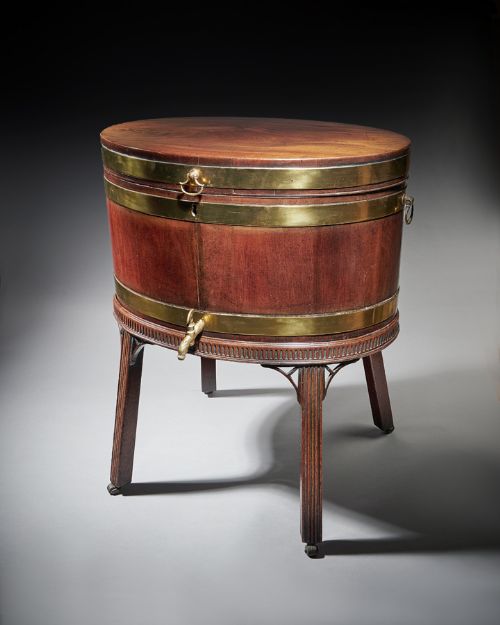 GEORGE III MAHOGANY OVAL BRASS BOUND WINE COOLER OF THE ADAM PERIOD