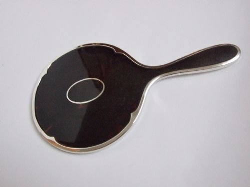 A Gorgeous Silver and Tortoiseshell Hand Mirror.