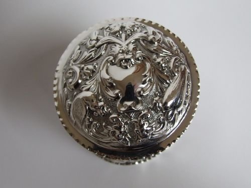 fig 1. A stunning William Comyns Victorian silver repousse powder pot.