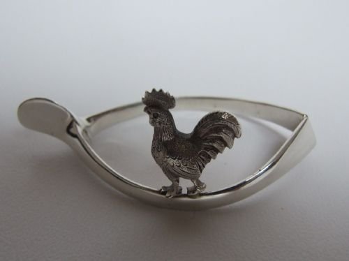 Extremely Rare Silver Wishbone Napkin Ring with Rooster Motif.