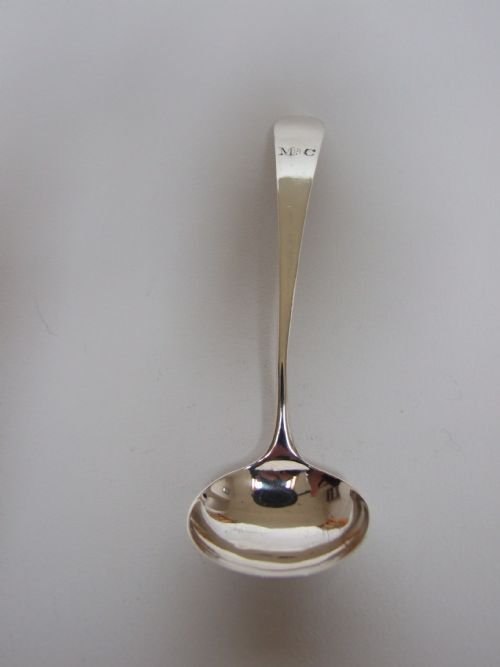 A Fine Georgian Silver Cream Ladle in Old English Pattern.