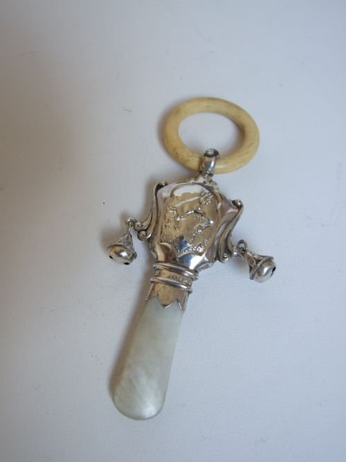 A Delighful Silver Baby's Rattle and Teether, with 'Cow Jumped Over the Moon' Motif.