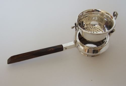 A Rare Asprey's Patented Silver Teastrainer and Drip Cup.