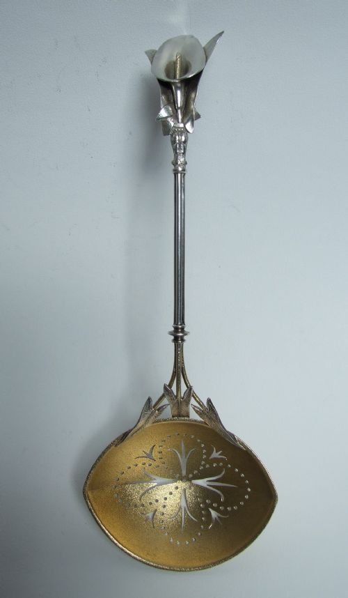 An Extraordinary Sterling Silver 'Lily' Sifter Spoon.