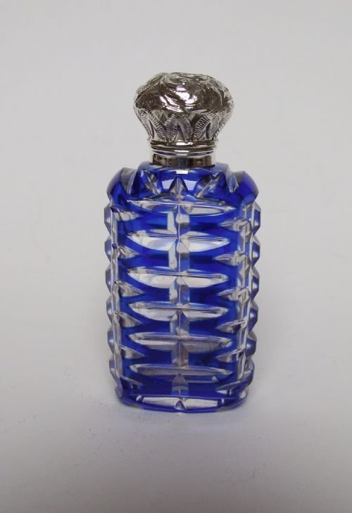 A Superb Victorian Silver Mounted Perfume Bottle.