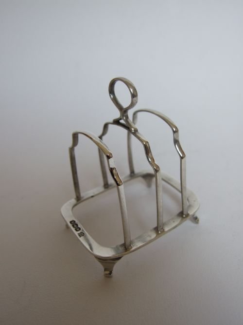 An Absolutely Charming Miniature Silver 'Solo' Toastrack